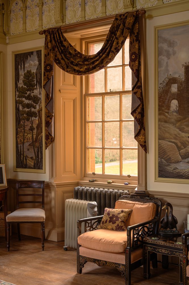 Cast-iron radiator, cane chair. Ballroom