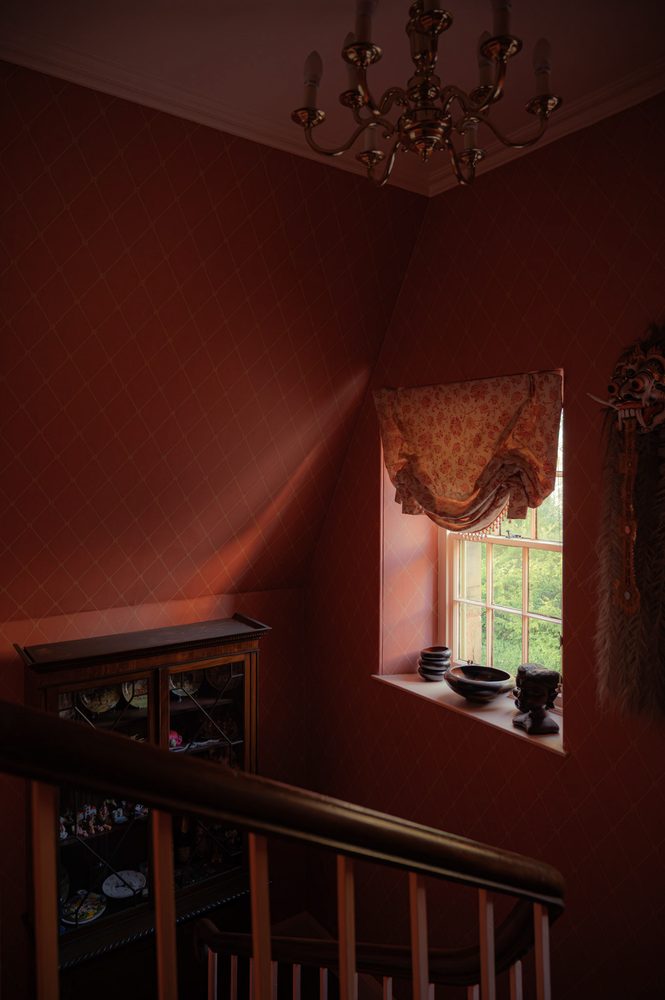 Stairwell with display cabinet and blind