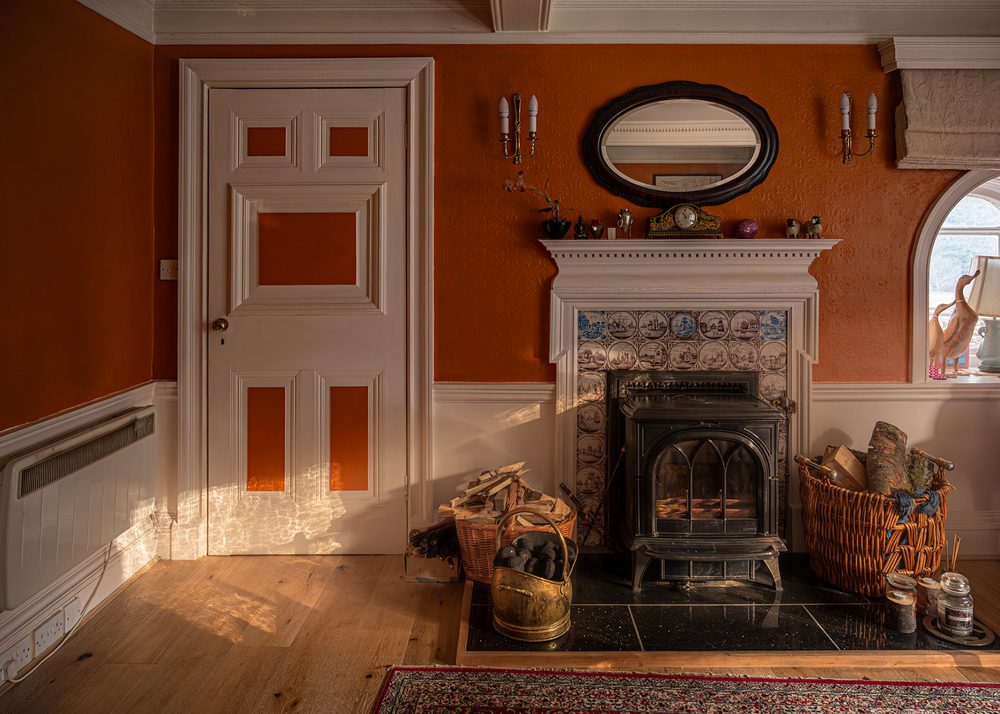 Stove set into the tiled chimneypiece