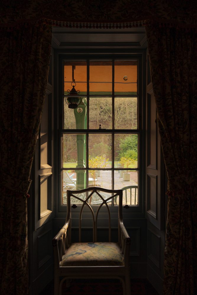 Window seat framed by curtains