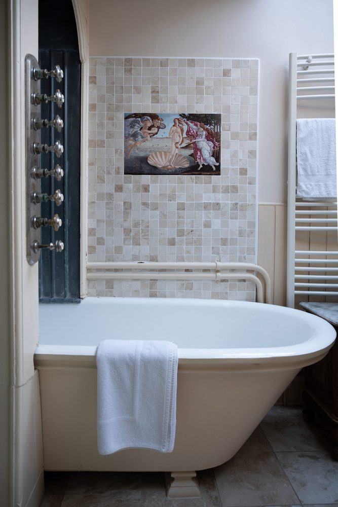 Roll-top bath and mosaic tiling